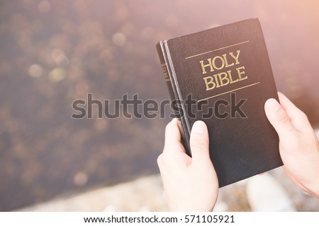 Holy bible,Teenager man holding Holy bible ready for read and have relationship with god faith, spirituality and religion concept.