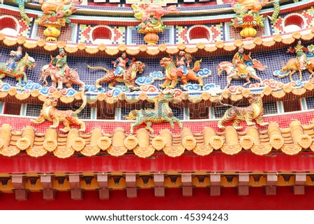 Chinese temple decoration on oriental taoism temple roof with god,dragon,tiger,lion,unicorn.