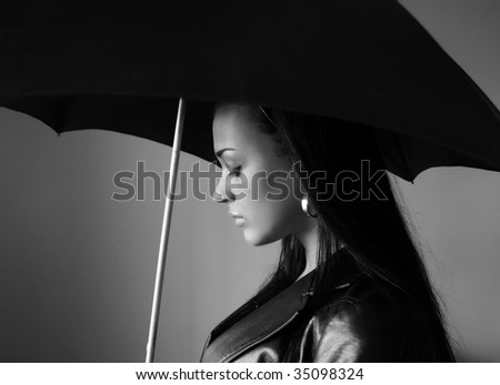 Black and white young woman with umbrella