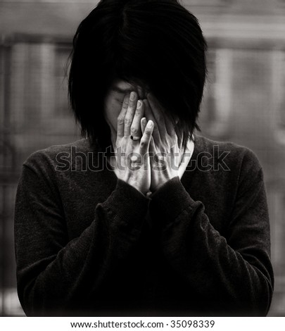 Black and white young asian man covered his face