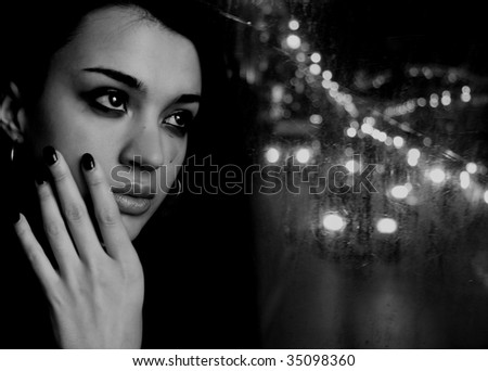 Black and white crying woman looking on a street