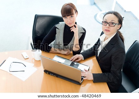 Girl and women with notebook