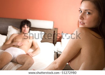 stock photo Boy in bed and naked girl