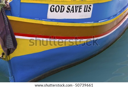 A boat with slogan \'God save us\'