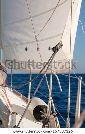 Rigging, ropes, shrouds and sail crop on the yacht