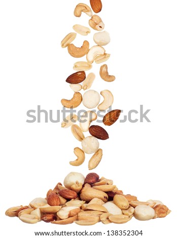 pile of macadamia, almond and cashew nuts isolated on white background