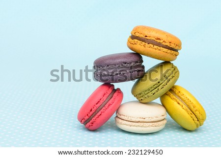 Colorful macaroon on blue vintage table cloth