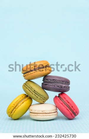 Colorful macaroon on blue vintage table cloth