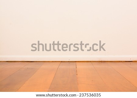 wooden floor and white wall