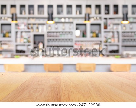 Retro bar counter with bottles in blurred background