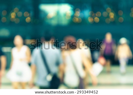 Blur Asian people walking in city outside of a shopping mall