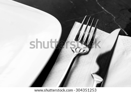 Fork knife table setting in classic black and white