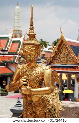 Golden Kinnorn (half giant - half bird) figure at Wat Prakaew, Thailand\'s ancient royal temple and palace.