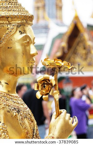 Golden Kinnorn (half man - half bird) figure at Wat Prakaew, Thailand\'s ancient royal temple and palace.