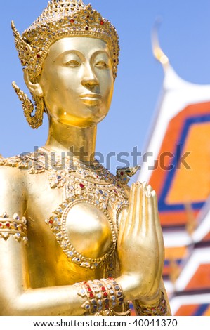 Golden Kinnaree (half woman - half bird) figure at Wat Prakaew, Thailand\'s ancient royal temple and palace.