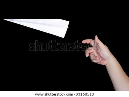 Handmade white origami paper plane isolated on black background