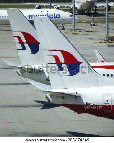 KUALA LUMPUR INTERNATIONAL AIRPORT - JULY 18, 2014: Malaysia Airlines aircraft tail logo at KLIA, Sepang, Malaysia. Malaysia Airlines MH17 crashes on Ukraine-Russia border today, killing 295 people