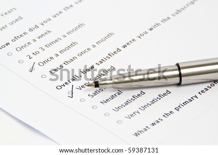 Pen Pointing at Survey and Questionnaire Form, business concept