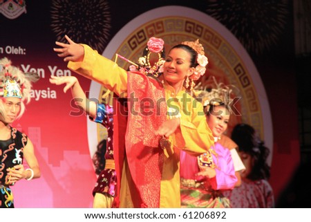 KUALA LUMPUR, MALAYSIA - SEPTEMBER 17 : A Beautiful Malay woman with traditional cloth  performing a dance for the Lantern Festival September 17, 2010 in Kuala Lumpur Malaysia.