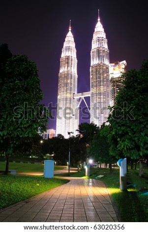 KUALA LUMPUR - OCTOBER 14: Beautiful night lighting of Petronas Twin Towers (KLCC) October 14, 2010 in Kuala Lumpur, Malaysia.  The Petronas Twin Towers remain the tallest twin buildings in the world.
