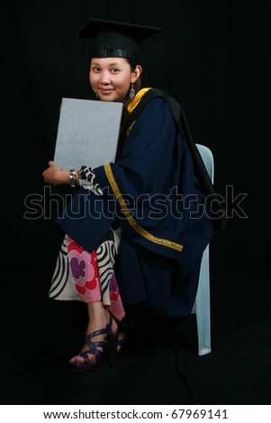 Cute Asian Student in Graduation Gown