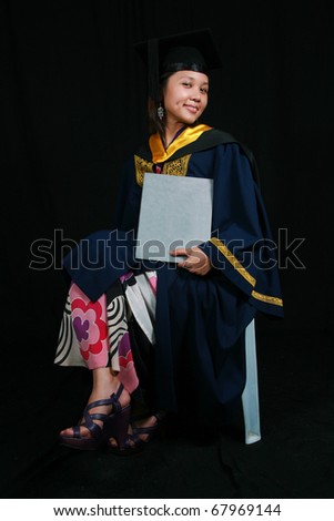 Cute Asian Student in Graduation Gown