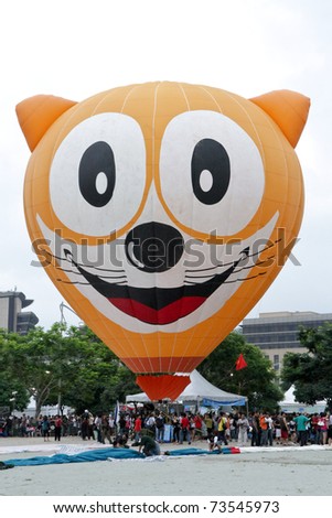 PUTRAJAYA, MALAYSIA - MARCH 20: Unique Cat face balloon ready to liftoff during Putrajaya 3rd International Hot Air Balloon Fiesta on March 20 2011 at Putrajaya, Malaysia.