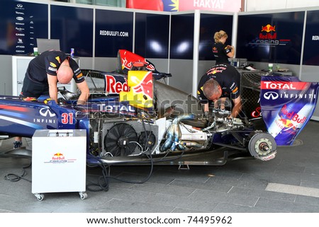 KUALA LUMPUR, MALAYSIA - APRIL 3: Maintenance check by Team Redbull crew at F1 street demonstration on April 3, 2011 in KL, Malaysia. The car will be driven by David Coulthard.