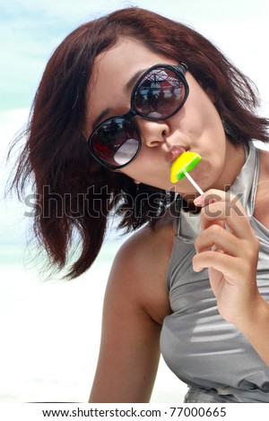 Girl eating candy having fun outdoor