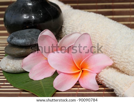 Spa Concept: Frangipani Flower, Zen Stone, & Face Towel bamboo mats