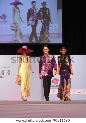 KUALA LUMPUR, MALAYSIA - DEC 10: Models walk the runway wearing batik design dress by Rosazlin Collection during Kuala Lumpur International Batik at Kuala Lumpur Convention Centre on Dec 10, 2011 in Kuala Lumpur, Malaysia.