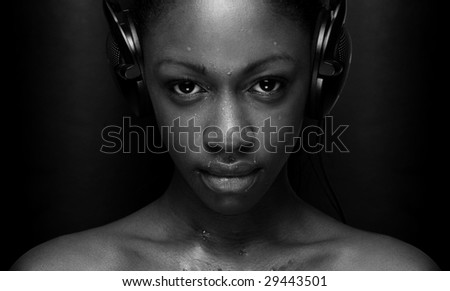 girl listening to music looking happy sexy in black and white
