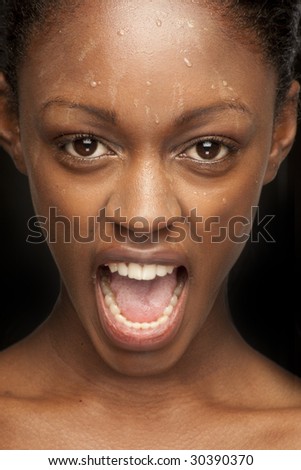 Beauty black skin woman with nice screaming expression isolated on black