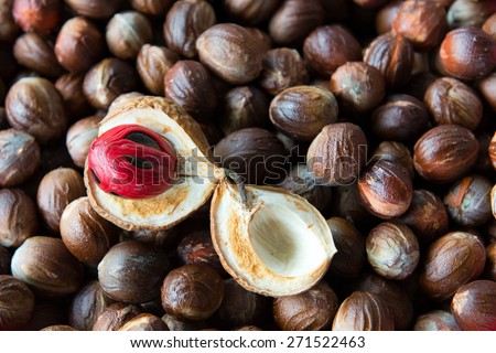 Close up shot of cut open nutmeg with red seed inside