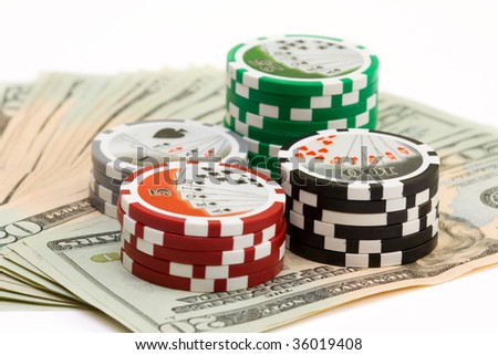 stack of poker chips with cash money on white background