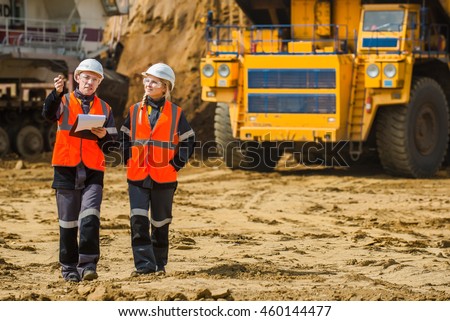 Man and woman working in an open-pit