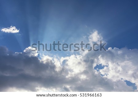 Overcast blue sky with sun beam,