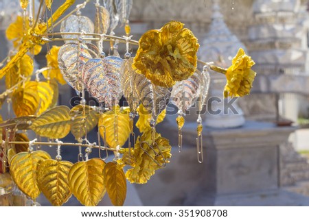 Golden leaf and Silver leaf on branch