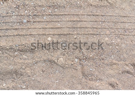 Abstract background - the wheel tracks in the sand.
