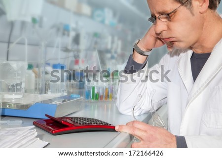 A Chemist is calculating the right Liquid values for a chemical Test to make the best decision.