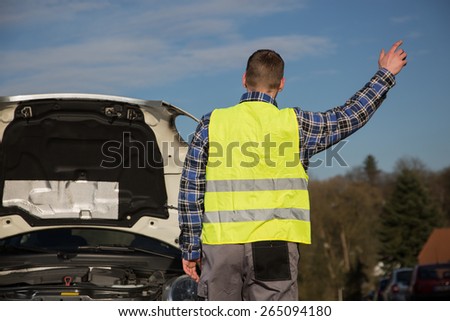 A young man asks for help on the road near her broken car