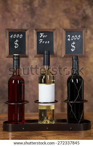 Three bottles of wine. One for free and two expensive wine bottles.