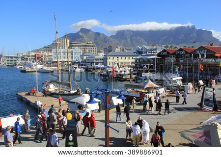CAPE TOWN, SOUTH AFRICA - NOVEMBER 24, 2011 - Victoria and Alfred Waterfront, harbor with recreation boats, shops, restaurants and Table Mountain on background in Cape Town, South Africa.