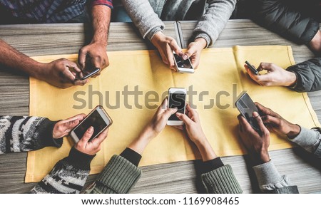 Group of friends having fun with smartphones - Closeup of hands social networking with mobile cellphones - Wifi connected people, technology, millennial and z generation concept