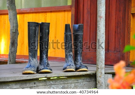 Black Wellington Boots on a deck