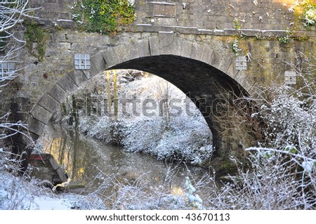 Snowy old stone bridge on the Royal Canal, Dublin, Ireland