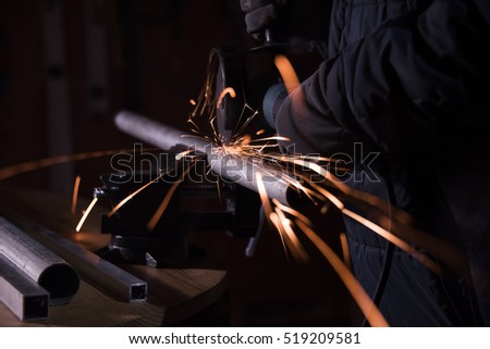 Cutting metal pipe with angle grinder