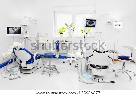Dental office with blue dental chair