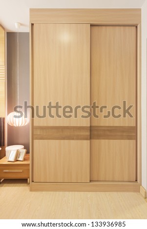 sliding doors wardrobe furnishing in small room.