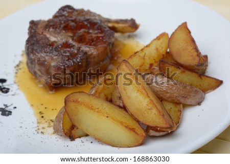roasted pork ribs in the glaze with potatoes